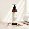 Le Labo Rose 31 Shampoo 480ml lifestyle on cream marble with rose petals
