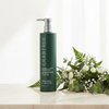 Crabtree & Evelyn Cleanse + Clarify Shampoo 443ml lifestyle on cream marble with botanicals