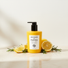 Acqua di Parma Alle Colonia Hand Wash 300ml lifestyle on cream marble with lemon and rosemary