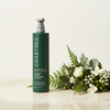 Crabtree & Evelyn Moisturizing Body Lotion 443ml lifestyle on cream marble with botanicals